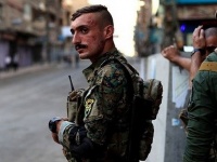 Столкновения между сирийскими военными и курдской полицией произошли в Камы ...